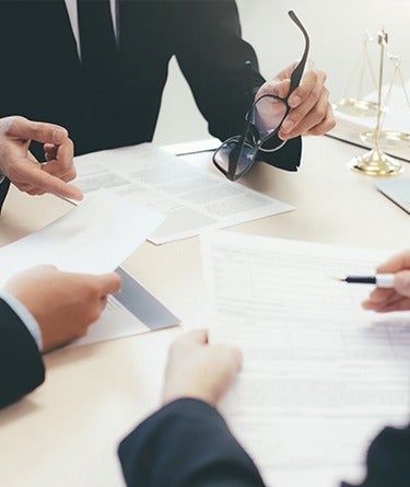 image of people looking over documents